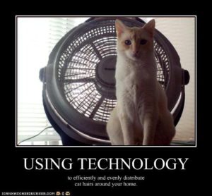 Picture of cat in front of fan with caption, Using Technology to evenly and efficiently distribute cat hairs around your home.